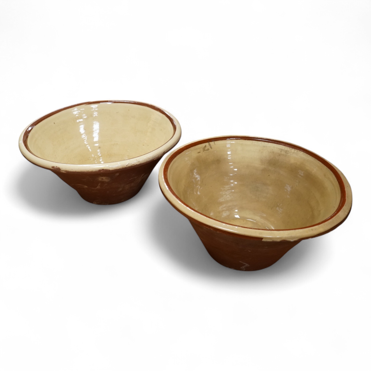 A pair of large slipware dairy bowls, 44cm diameter